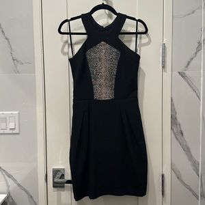 Black cocktail dress with pink/black pebbled leather detailing